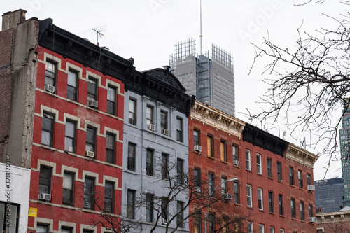 Row of Old Colorful Brick Residential Buildings in Hell's Kitchen of New York City © James