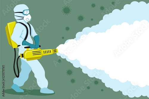 Medic in a protective suit and mask on a green background makes disinfection from viruses.