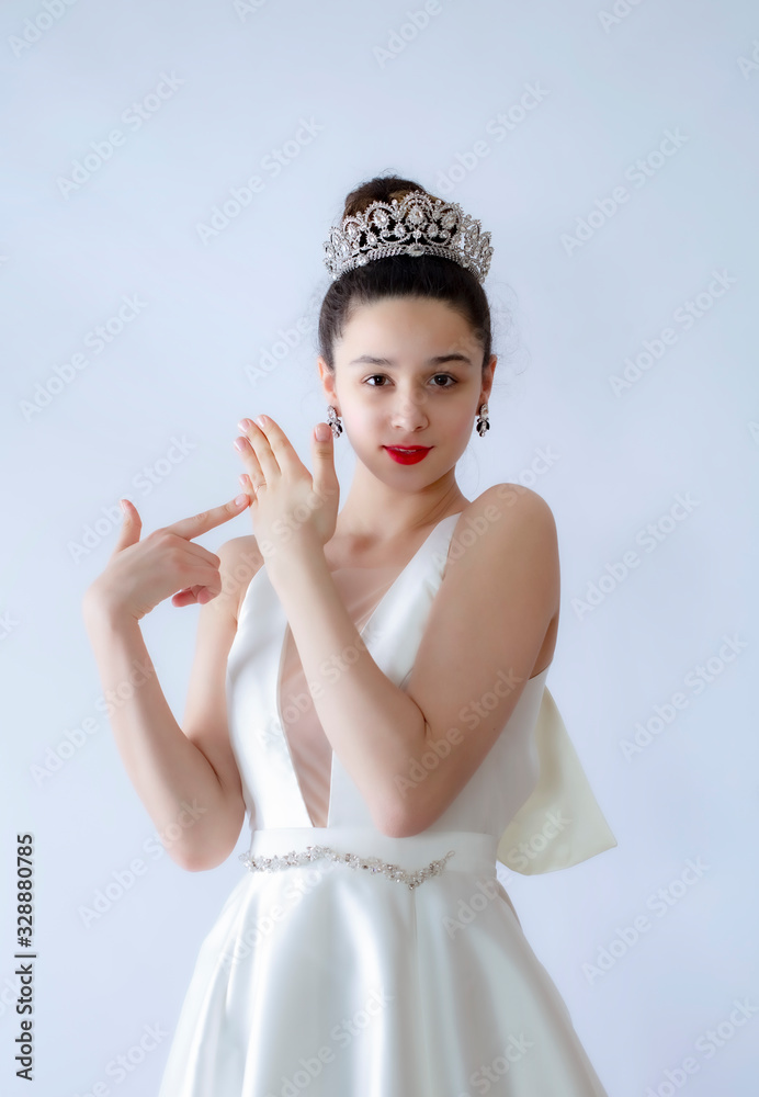 Happy cheerful bride shows hand with ring. Glad pretty fiancee shows tongue looking at camera. Isolated Happy cheerful bride shows hand with ring. Glad pretty fiancee shows tongue looking at camera. Isolated