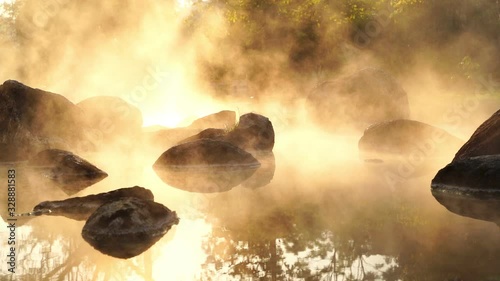 Japanese Hot Springs Onsen Natural Bath Surrounded by red-yellow leaves. In fall leaves fall in Yamagata. Japan.