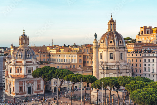 Aerial view of domes of Santa Maria di Loreto church at sunset in Venice Square in Rome, Italy.