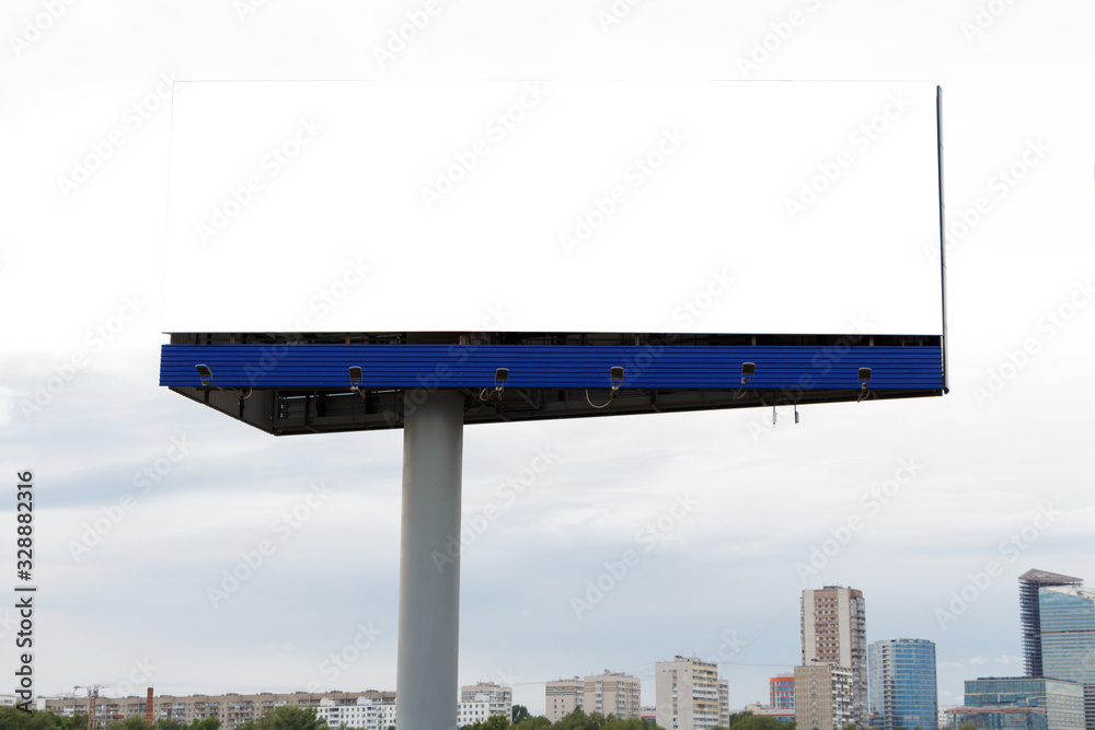 Fototapeta premium Billboard horizontal on the background of the city, cloudy sky.