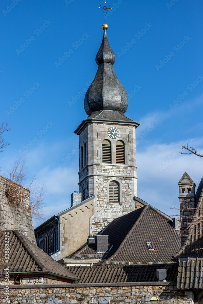 Fototapeta premium View at the tower of church Saint Lucia in Stolberg, Eifel