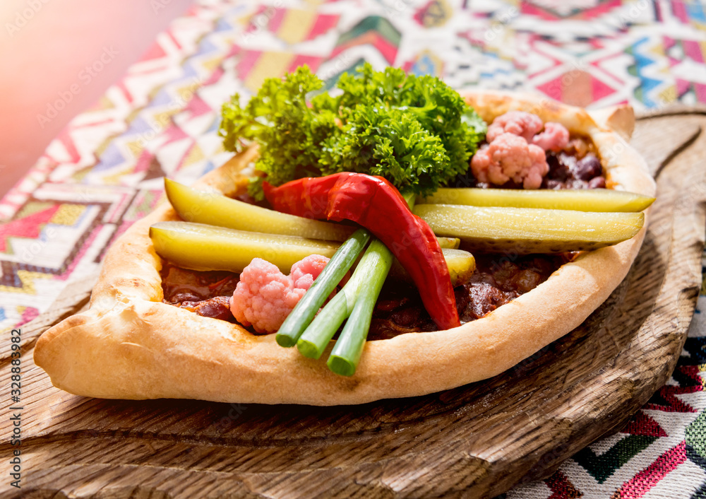 Khachapuri with cheese, vegetables and eggs. Georgian national cuisine. Khachapuri with cheese, vegetables and eggs. Georgian national cuisine.