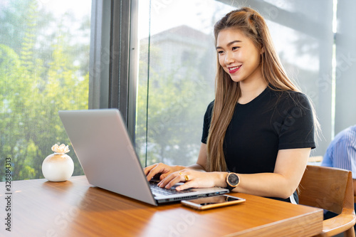 Beautiful Attractive Asian woman working with computer laptop and thinking to get ideas and requirement in Business startup feeling so happiness,Business Startup Concept