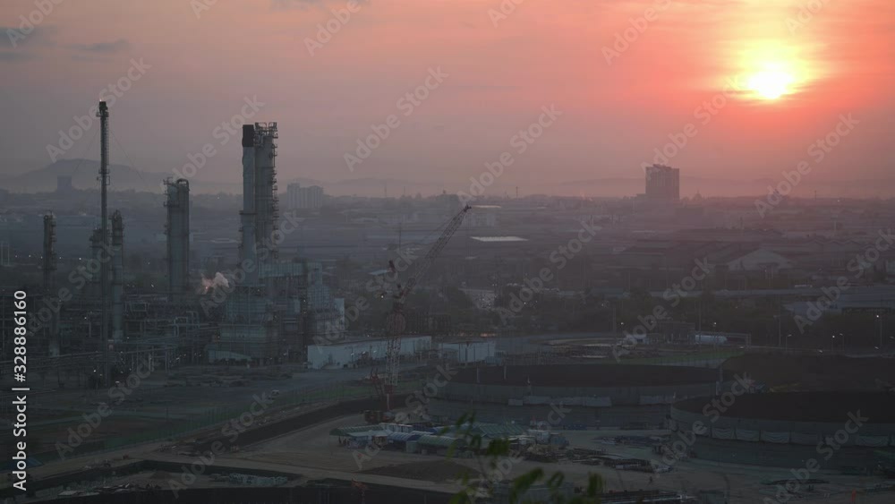 Oil refinery with sunrise. business technology presentation concept.