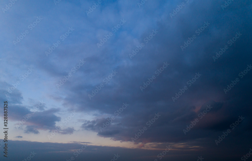 Dark cloudy sky with red reflections at sunset. Dark cloudy sky with red reflections at sunset.