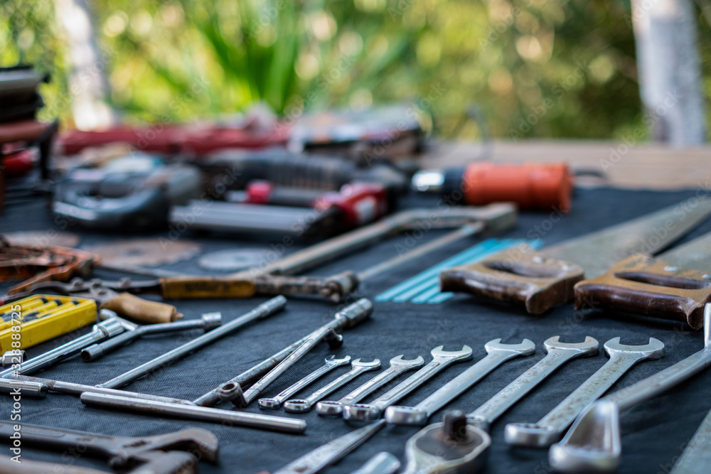 Fototapeta premium Photo top view a huge set collection of working hand and power tools many for the wooden on isolated black background