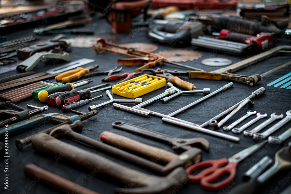 Fototapeta premium Photo top view a huge set collection of working hand and power tools many for the wooden on isolated black background