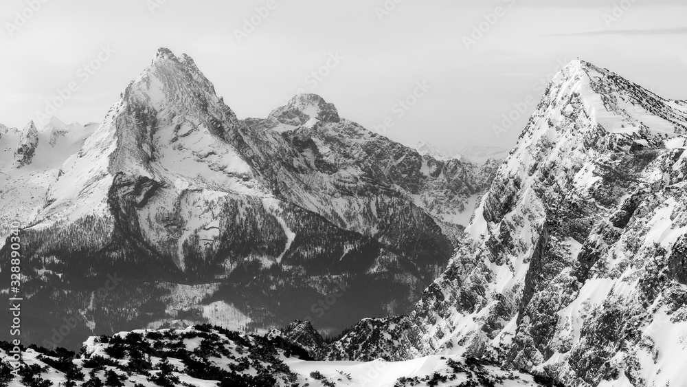 view of mountain watzmann in national park berchtesgadener land from mountain untersberg winter / spring 2020 in black and white