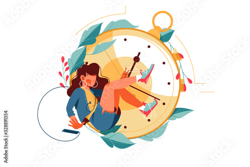 Attractive girl silhouette using smartphone kills time near clock.
