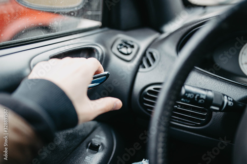 driver opens the car door from the inside, leather upholstery.