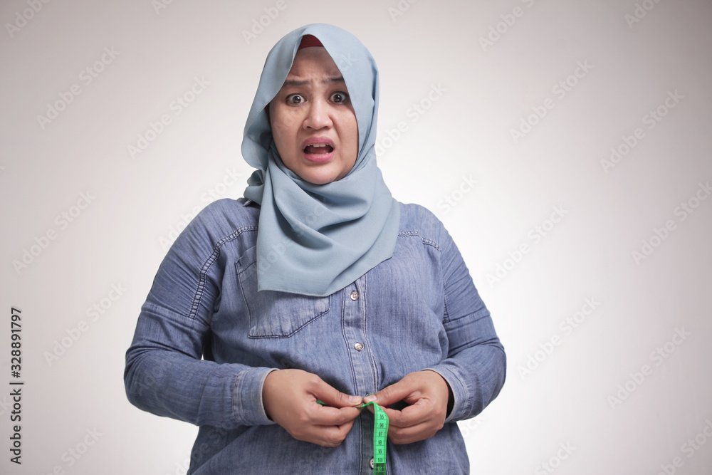 Funny Fat Asian Muslim Woman Measuring Waist Stock Photo | Adobe Stock Funny Fat Asian Muslim Woman Measuring Waist Stock Photo | Adobe Stock