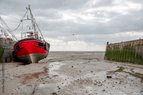 Cuadro en lienzo Fisherman boats stuck on the beach in low tide period.