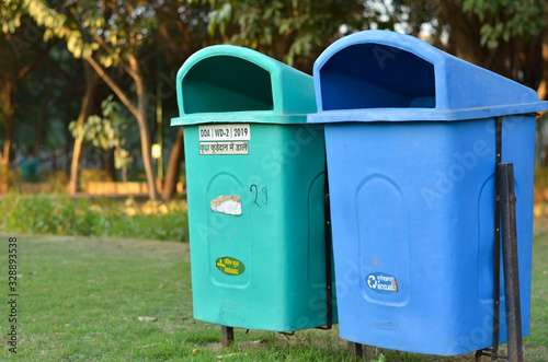 New Delhi government has installed a lot of green & blue dustbins throughout the city, this one in a park. The green ones for organic waste, & blue for non organic, non recyclable waste photo