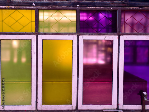 Four the window made form wooden and multicolored mirror. The reflection is beautiful. pattern vintage, colourful glasses.