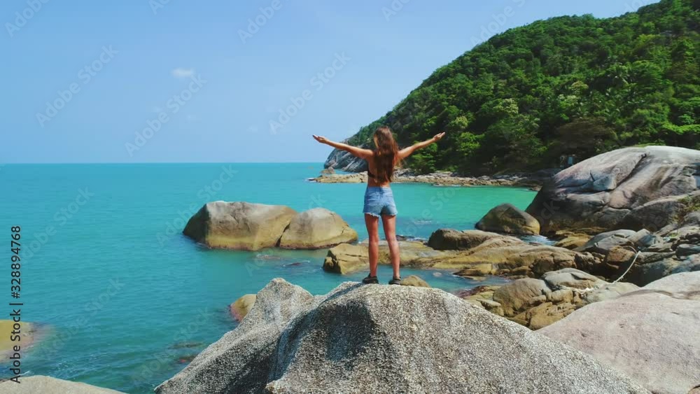 Exotic Beach Girl Stand On Rocky Chunk Drone View. Turquoise Water Surface Tidal Wave Mount Hills Covered by Forest Trees. Asian Island Nature Beauty Vacation Natural Environment Concept Thailand 4K Exotic Beach Girl Stand On Rocky Chunk Drone View. Turquoise Water Surface Tidal Wave Mount Hills Covered by Forest Trees. Asian Island Nature Beauty Vacation Natural Environment Concept Thailand 4K