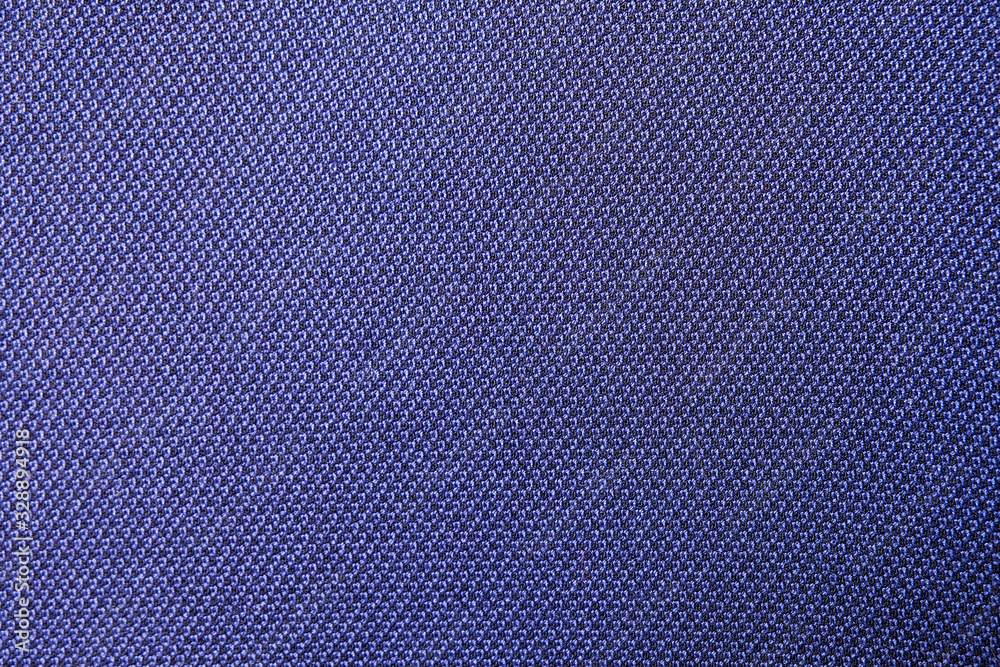 Close up shot of midnight dark blue formal suit cloth textile surface ...
