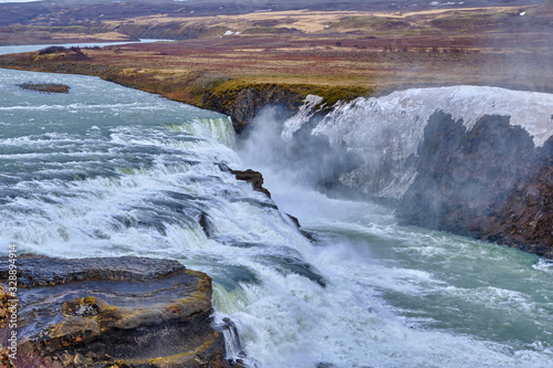 The beautiful and fast flowing GullFoss Waterfall on Southern Iceland formed by the Hvita River photo