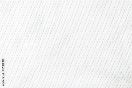 Selective focus, White mesh fabric background. cloth sport wear texture for exercise. light weight, good air flow, cool and easy to dry from sweat. abstract wallpaper with copy space for text.