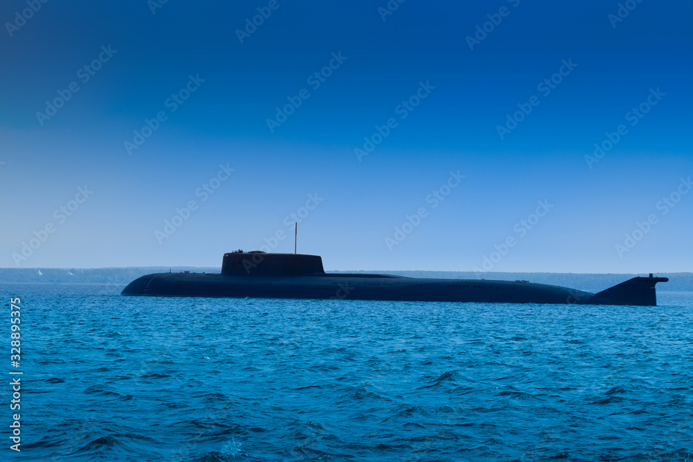 Military submarine. Submarine during ascent. Military submarine without identification marks. Naval forces. Concept - shipbuilding. Water weapon. The ship sank under water. Ascent.