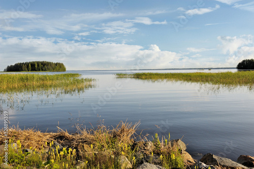 Fototapeta Naklejka Na Ścianę i Meble -  Peaceful Beauty of Summer Afternoon in the Lake Pyhaselka, Joensuu, Northern Karelia, Finland in July 2019