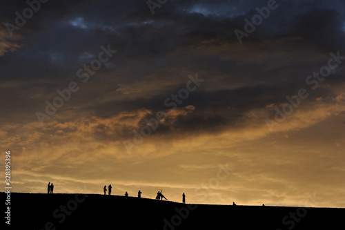 People Watching Sunset in the Jade Island, Changli County, Hebei Province, China in July 2016 photo