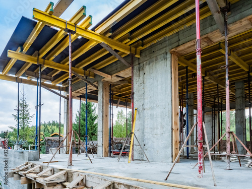 Unfinished building. Empty construction site. Concept - Country of Real Estate. Concept - Building a house for sale. Second floor of a building under construction. Construction company services photo