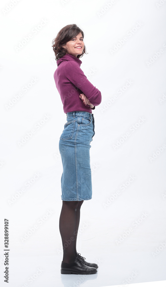 side view. fashionable young woman in denim skirt. side view. fashionable young woman in denim skirt.
