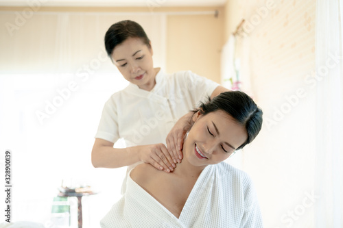 Young Woman during Spa Salon Body massage Hands Treatment.