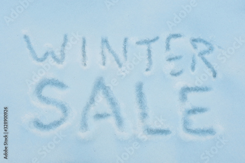 The inscription "winter sale" carelessly written in the snow