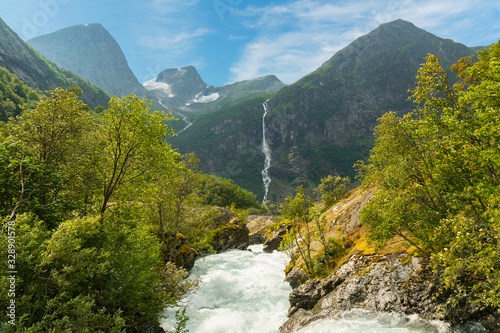 Waterfall stream mountain green landscape, National park Jostedalsbreen, Norway.