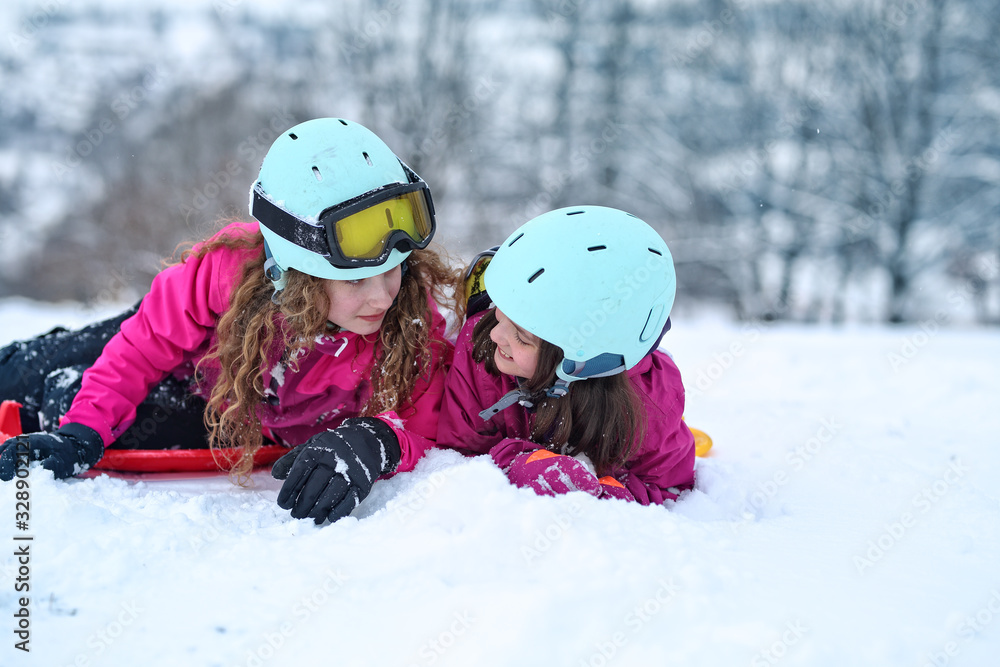 teen friends laugh on a winter day on the ski slope teen friends laugh on a winter day on the ski slope