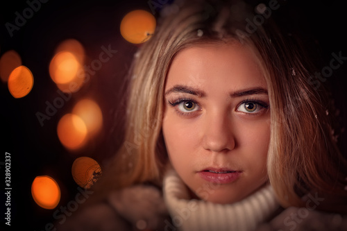 young woman portrait in winter evening