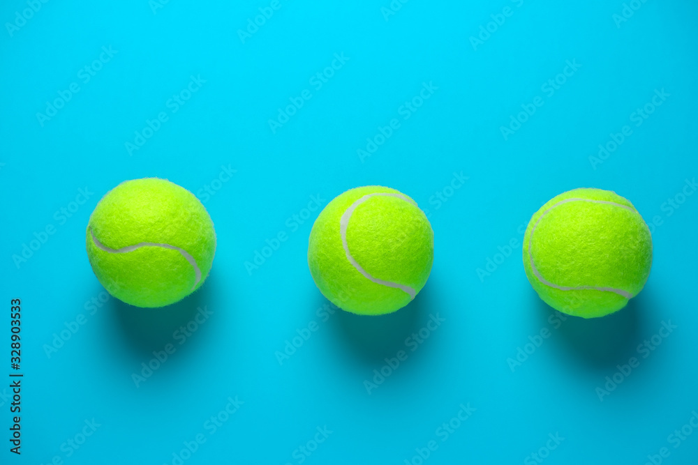 three tennis balls on a bright blue background 스톡 사진 | Adobe Stock