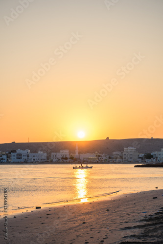 Sunrise with some boats at Sur's bay, Oman