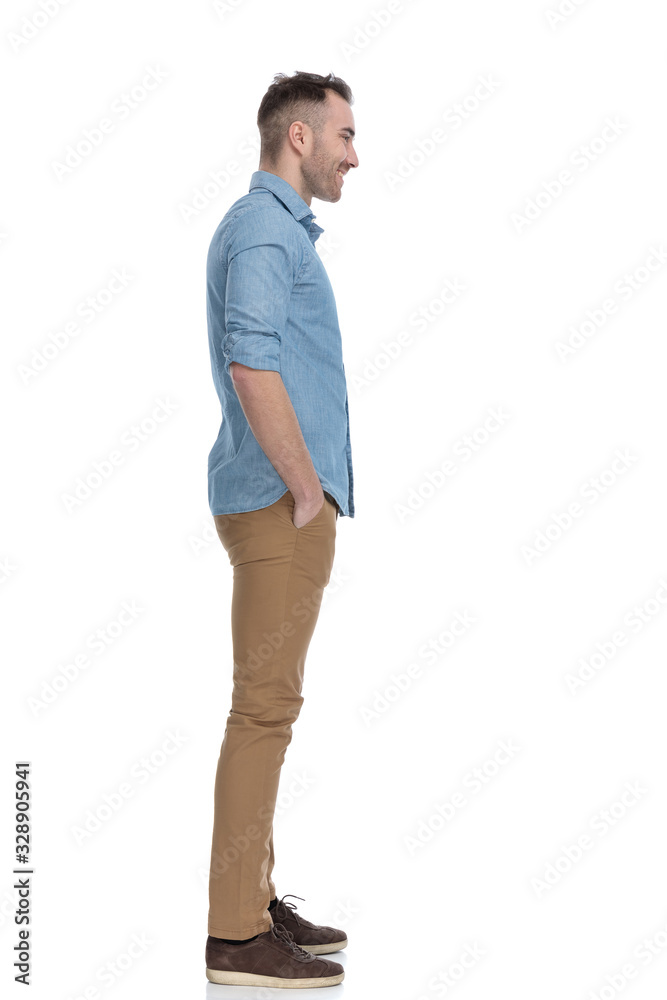 Side view of positive casual man smiling