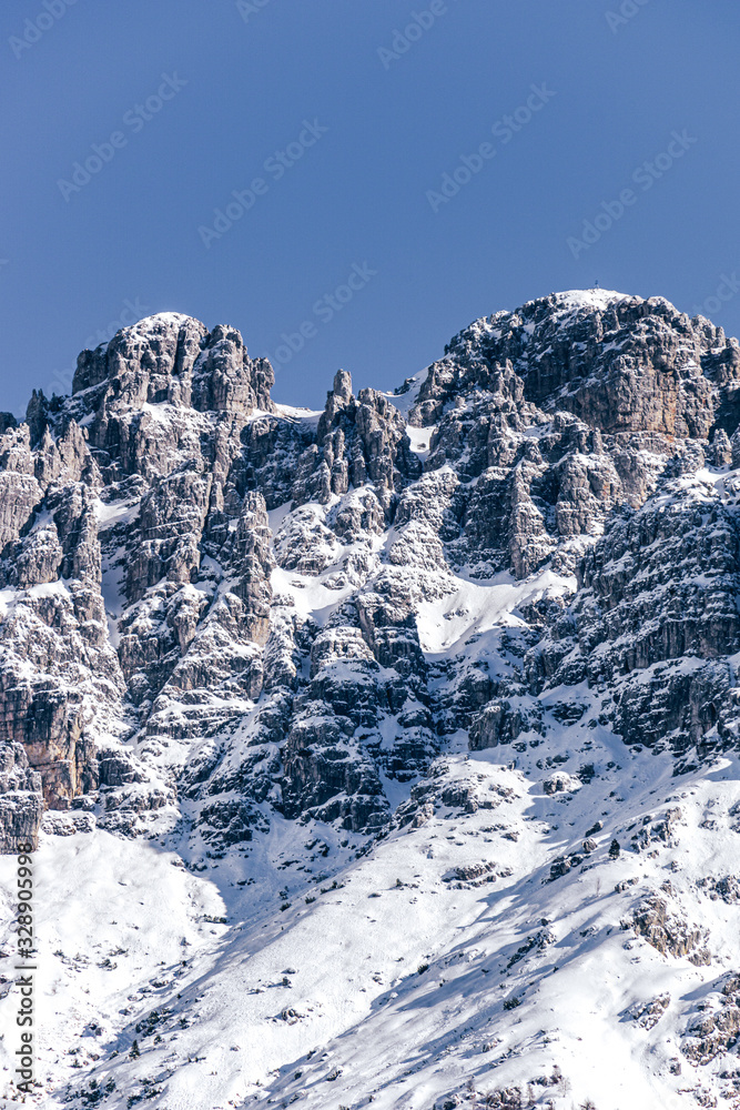 The mountains of the valsassina just after a snowfall during a fantastic winter day near the town of Barzio, Italy - March 2020