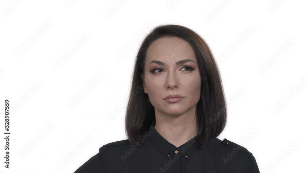 Portrait shot of a puzzled young pretty woman demonstrating doubting emotion. Body language concept. Isolated, on white background Portrait shot of a puzzled young pretty woman demonstrating doubting emotion. Body language concept. Isolated, on white background