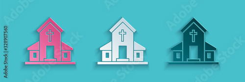 Paper cut Church building icon isolated on blue background. Christian Church. Religion of church. Paper art style. Vector Illustration