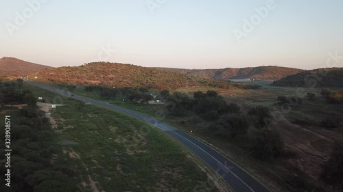 4K aerial drone video of greeen savanna hills and Avis Dam near historical railway bridge on main B6 road from Windhoek to Gobabis in central highland Khomas Hochland of Namibia, southern Africa photo