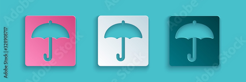Paper cut Umbrella icon isolated on blue background. Waterproof icon. Protection, safety, security concept. Water resistant symbol. Paper art style. Vector Illustration