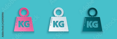 Paper cut Weight icon isolated on blue background. Kilogram weight block for weight lifting and scale. Mass symbol. Paper art style. Vector Illustration
