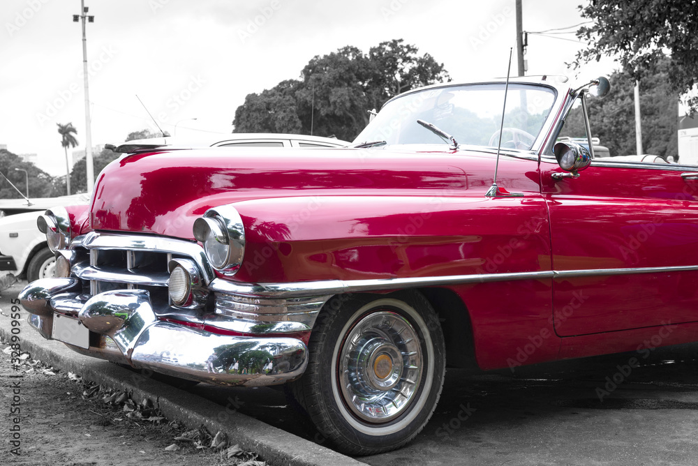 frontside of old red classic convertible car in cuba frontside of old red classic convertible car in cuba