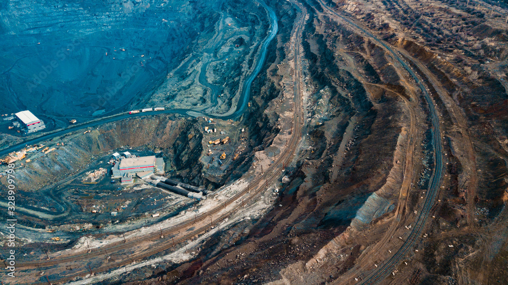 Aerial view of the Iron ore mining, Panorama of an open-cast mine extracting iron ore, preparing for blasting in a quarry mining iron ore, Explosive works on open pit