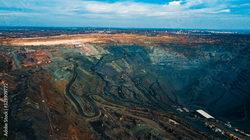 Aerial view of the Iron ore mining, Panorama of an open-cast mine extracting iron ore, preparing for blasting in a quarry mining iron ore, Explosive works on open pit