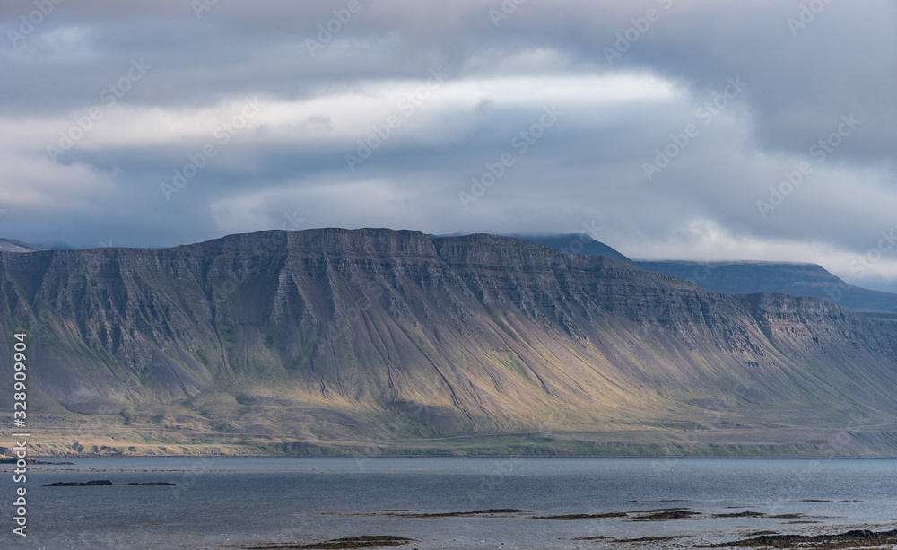 Landscape of westfjord with cloudy sky - Iceland.