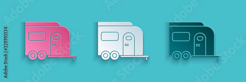 Paper cut Rv Camping trailer icon isolated on blue background. Travel mobile home, caravan, home camper for travel. Paper art style. Vector Illustration