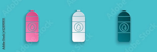 Paper cut Plastic canister for motor machine oil icon isolated on blue background. Oil gallon. Oil change service and repair. Paper art style. Vector Illustration
