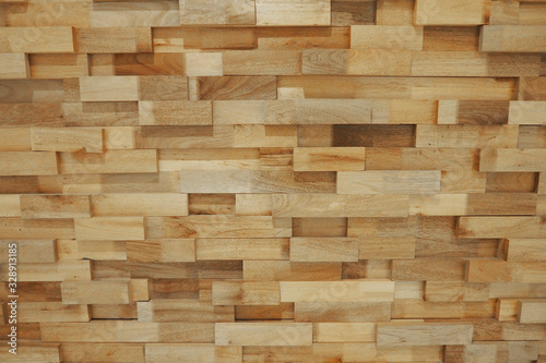 Beautiful wooden blocks wall with texture and rough surface in warm brown tone for background and decoration. 